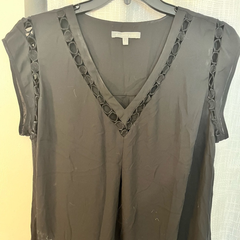 Black short sleeve blouse with cut out detail